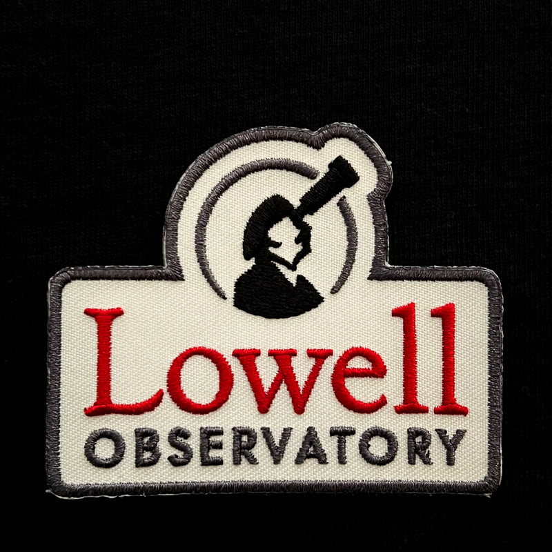 Patch with a white background, grey edges, and the Lowell Observatory logo. Red font reads, "Lowell Observatory"